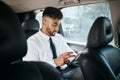 Business man, tablet and drive in car for online search, trading or reading stock market news in traffic. Indian trader Royalty Free Stock Photo