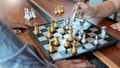 Business man take a king figure checkmate on the chess board game - strategy, management or leadership success concept Royalty Free Stock Photo