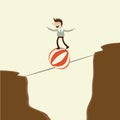 A business man takes a risky dangerous walk on a tightrope and p