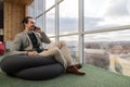 Business Man Talking Cell Smart Phone Call Sit in front Panoramic Window Businessman In Coworking Center Royalty Free Stock Photo