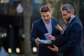 Business man talking on outdoor meeting. Devising big plans with the boss. Business partners are discussing something Royalty Free Stock Photo