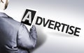 Business man with the text Advertise in a concept image