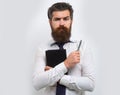 Business man is thinking about something with pencil. Business dreams. Thoughtful young man in shirt and tie holding Royalty Free Stock Photo