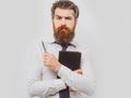 Business man is thinking about something with pencil. Business dreams. Thoughtful young man in shirt and tie holding Royalty Free Stock Photo