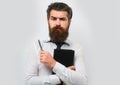 Business man is thinking about something with pencil. Business dreams. Thoughtful young man in shirt and tie holding Royalty Free Stock Photo