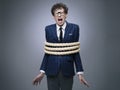 Business man tied up with rope Royalty Free Stock Photo
