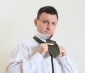 Business man ties a necktie Royalty Free Stock Photo