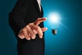 Business man touching light of idea Royalty Free Stock Photo