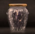 Business man trapped in jar with exclamation marks concept Royalty Free Stock Photo