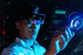 Business man try vr glasses hololens in the dark room. Young asian boy experience ar with glow earth globe on hand. Future Royalty Free Stock Photo