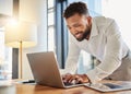 Business man typing on a laptop at his desk in an office happy about writing a marketing growth strategy. Innovation Royalty Free Stock Photo