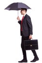 Business man with umbrella and briefcase Royalty Free Stock Photo