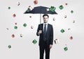 Business man with umbrella under gift boxes rain Royalty Free Stock Photo