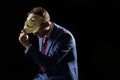 Business man under the mask disguise being Anonymous and implying that he is a hacker or anarchist Royalty Free Stock Photo