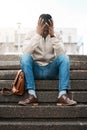 Business man, unemployed and depression on stairs with mistake, reflection and worry in city. African person, stress and Royalty Free Stock Photo