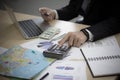 Business man using calculator holding credit card for shopping online with laptop computer on office table. Royalty Free Stock Photo