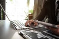 Business man using digital tablet analyzes business data, busy working on laptop computer. Royalty Free Stock Photo