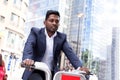 Business man using hire bike Royalty Free Stock Photo