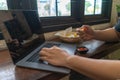 Business man using laptop computer, hand typing notebook keyboard and eating fast food French fries with ketchup..Sedentary Royalty Free Stock Photo