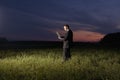 Business man using laptop in field Royalty Free Stock Photo