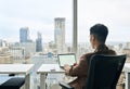 Business man working on laptop computer in office. White mock up screen Royalty Free Stock Photo