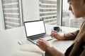 Business man working on laptop mock up screen in office. Over shoulder view Royalty Free Stock Photo