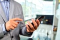 Business Man using Mobile Cell Phone in The Modern office buildi Royalty Free Stock Photo