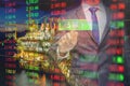 The business man using modern visual technology for trading to sell in oil and gas stock market with index graph and indicator