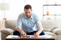 Business man using tablet at home and writing notes Royalty Free Stock Photo