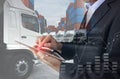 Business man is using tablet to calculate financial with Transport business logistics Royalty Free Stock Photo
