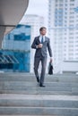 Business man walking down the street of a big city Royalty Free Stock Photo