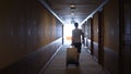 Business man walking at hotel corridor. Businessman with luggage arriving at hotel. Tourist man settling in business Royalty Free Stock Photo