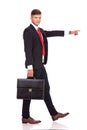 Business man walking & pointing Royalty Free Stock Photo