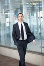 Business man walking on sidewalk in the city Royalty Free Stock Photo