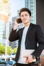 Business man walking on street and talking on phone Royalty Free Stock Photo