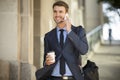 Business man walking talking on cell phone Royalty Free Stock Photo