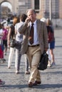 Business man walking and talking on the phone Royalty Free Stock Photo