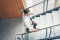 Business man walking to work. Business man on stairs talking on Royalty Free Stock Photo