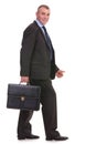 Business man walks with his briefcase Royalty Free Stock Photo