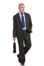 Business man walks toward the camera with briefcase Royalty Free Stock Photo