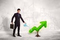 Business man watering green plant arrow Royalty Free Stock Photo