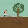 Business man watering money tree Royalty Free Stock Photo