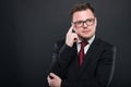 Business man wearing black suit making thinking gesture Royalty Free Stock Photo