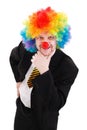 Business man wearing colorful clown wig