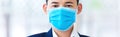 Business man wearing protection face mask against coronavirus. Banner panorama people preventive coronavirus disease or COVID-19