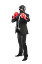 Business man wearing protective helmet and boxing gloves Royalty Free Stock Photo