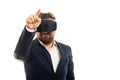 Business man wearing vr goggles pointing invisible touchscreen Royalty Free Stock Photo