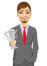 Business man winner holding a silver cup trophy Royalty Free Stock Photo