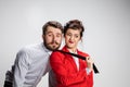 The business man and woman cooperating on a gray background