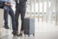 Business man and woman  Dragging suitcase luggage bag,walking to passenger boarding in Airport,travel to work.Asian tourist men Royalty Free Stock Photo